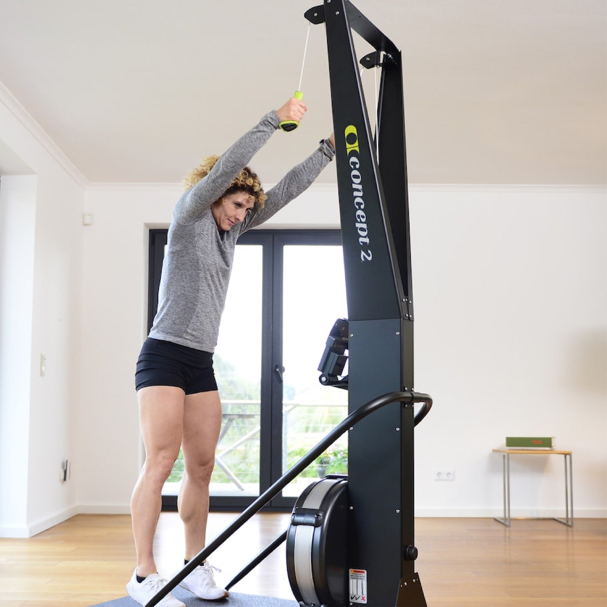 Woman training with Concept2 SkiErg Ski Machine